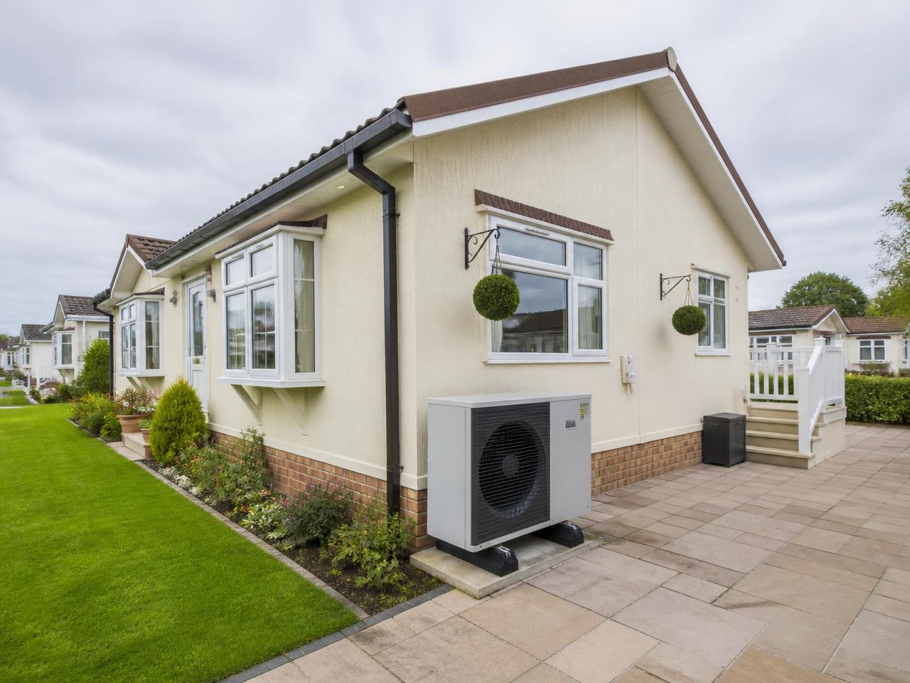 UK park home with a modern air source heat pump